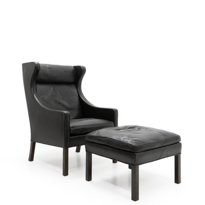 Black Leather Wingchair and Footstool by Borge Mogensen for Fredericia, 1960s, Set of 2-TJQ-1378679