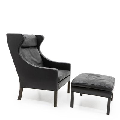 Black Leather Wingchair and Footstool by Borge Mogensen for Fredericia, 1960s, Set of 2-TJQ-1378679