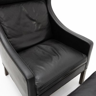 Black Leather Wingchair and Footstool by Borge Mogensen for Fredericia, 1960s, Set of 2-TJQ-1378679