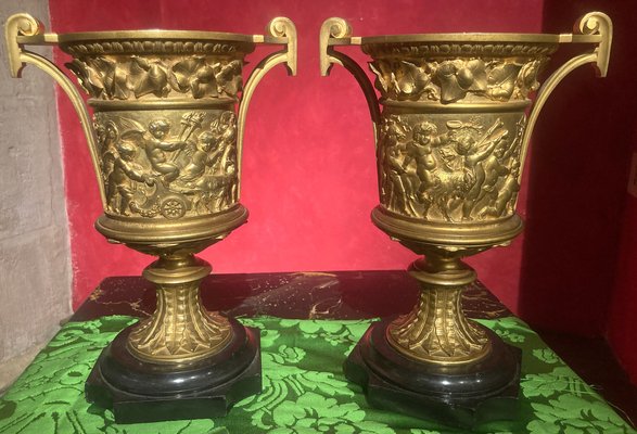 French 18th Century Louis XVI Ormolu Vases with Handles and Relief Putto on Black Belgian Marble Bases, Set of 2-AXE-1720640