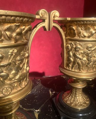 French 18th Century Louis XVI Ormolu Vases with Handles and Relief Putto on Black Belgian Marble Bases, Set of 2-AXE-1720640