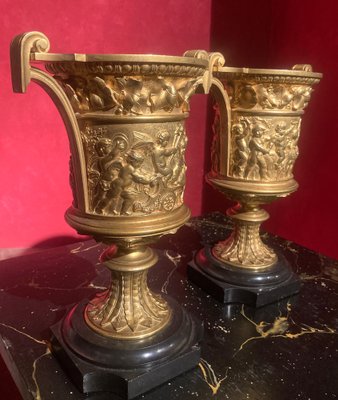 French 18th Century Louis XVI Ormolu Vases with Handles and Relief Putto on Black Belgian Marble Bases, Set of 2-AXE-1720640