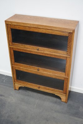 German Oak Bookcase with Folding Doors in Style of Globe Wernicke, 1930s-XO-1320887