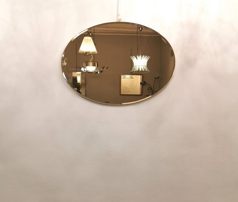 Italian Bronzed Glass Oval Wall Mirror, 1970s-ZST-1080574