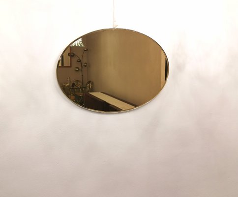 Italian Bronzed Glass Oval Wall Mirror, 1970s-ZST-1080574