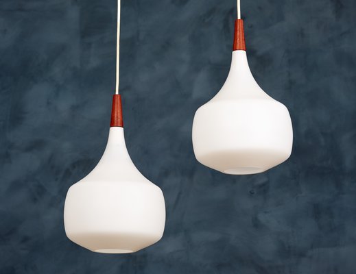 Mid-Century Danish Opaline Glass and Teak Pendant Lamps from Holmegaard, 1960s, Set of 2-ZGQ-712649