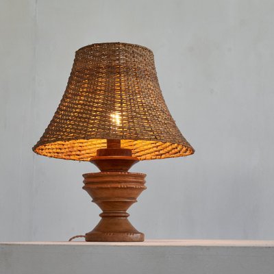 Wabi-Sabi Table Lamp in Turned and Carved Wood with Rattan Shade, 1920s-LPQ-1799946